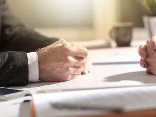 Business negotiation between businesswoman and businessman, ligh