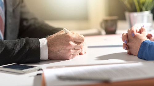 Business negotiation between businesswoman and businessman, ligh