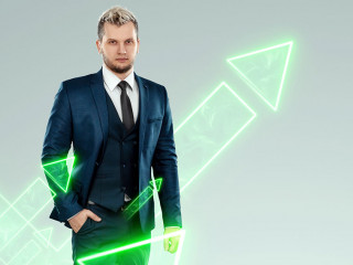 A businessman in a business suit looking for an opportunity against the background of green arrows pointing up. Development concept, start-up, investment search. Copy space.