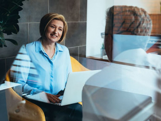 financial advisor with client in office