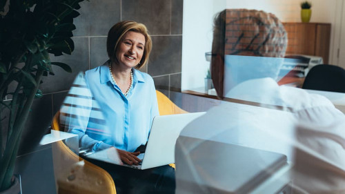 financial advisor with client in office