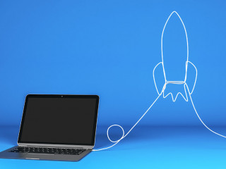 Blank laptop with rocket