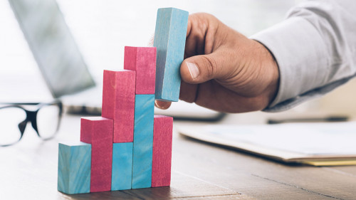 Businessman building a successful financial graph