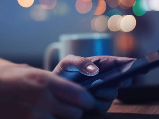Woman reading online news on digital tablet