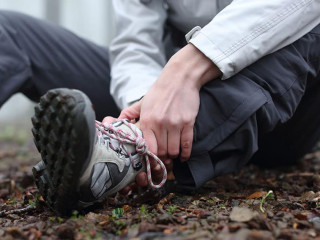 Trekker complaining alone in the mountain with broken ankle