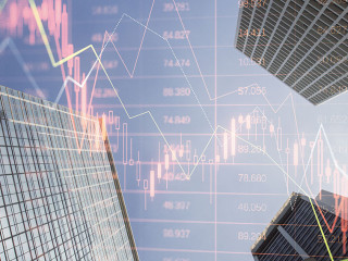 Real estate market crash and economy crisis concept with falling down digital financial chart candlestick and diagram with data indicators on city skyscraper tops bottom view, double exposure