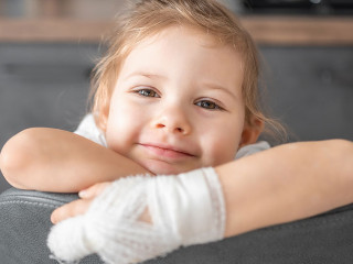 Little girl with broken finger at the doctor's appointment in the hospital