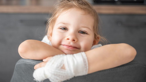 Little girl with broken finger at the doctor's appointment in the hospital