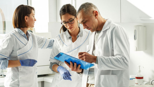 Medical dentist team in dental office discuss about practice and