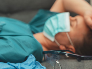 Tired medical worker after a shift. Burnout at work.