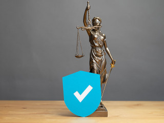 law symbol justice figure on wood table