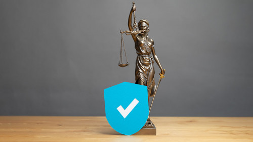 law symbol justice figure on wood table