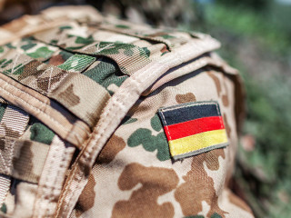 german flag on a german soldier desert uniform