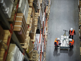 Workers Counting New Shipment in Warehouse