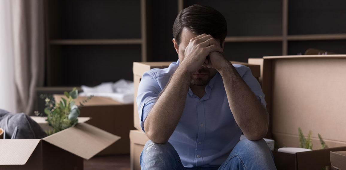 Sad desperate depressed homeowner, renter man leaving out from apartment