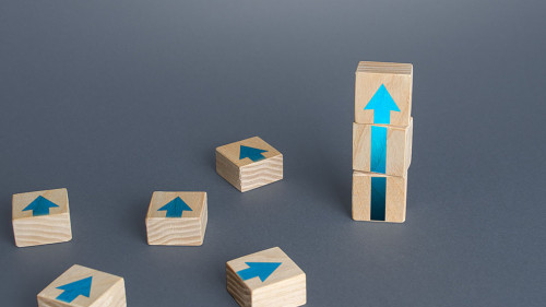 Block tower of arrows and extra blocks. Growth, development progress concept. Achieve success. Career promotion. Step by step. improving skills. Progress and movement forward. Goal achievement.