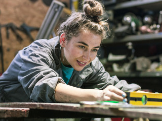 young woman working in workshop