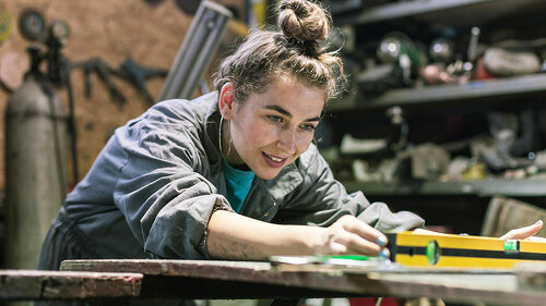young woman working in workshop