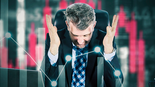 Stressed businessman feeling desperate on crisis stock market