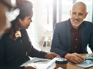 Business meeting, team and planning in office for strategy discussion, vision or success. Happy corporate group, woman and businessman for collaboration at financial agency for goal, target or budget