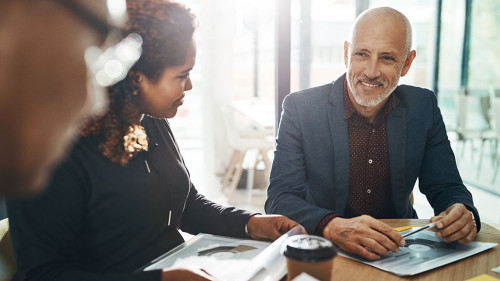 Business meeting, team and planning in office for strategy discussion, vision or success. Happy corporate group, woman and businessman for collaboration at financial agency for goal, target or budget