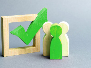 people stand near the checkbox for voting in elections. Lobbying interests, election corruption, voter bribery, rigging election results. Presidency elections. banner, place for text. Selective focus
