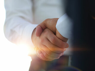 Business handshake and business people. Business concept.