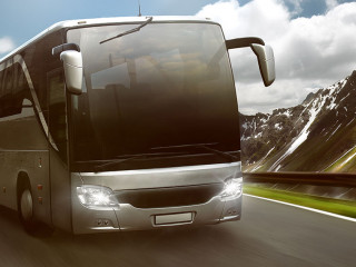 Bus in front of mountain landscape