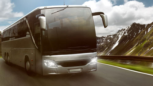 Bus in front of mountain landscape