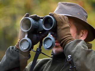 hunter looking through binoculars