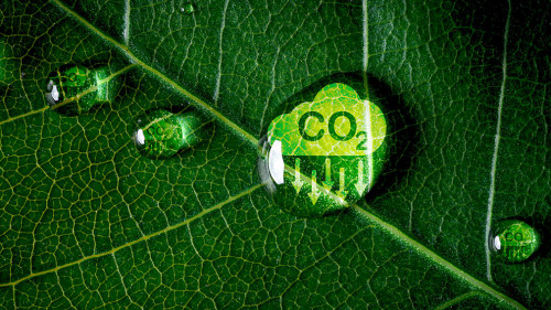 CO2 reducing icon on green leaf with water droplet for decrease