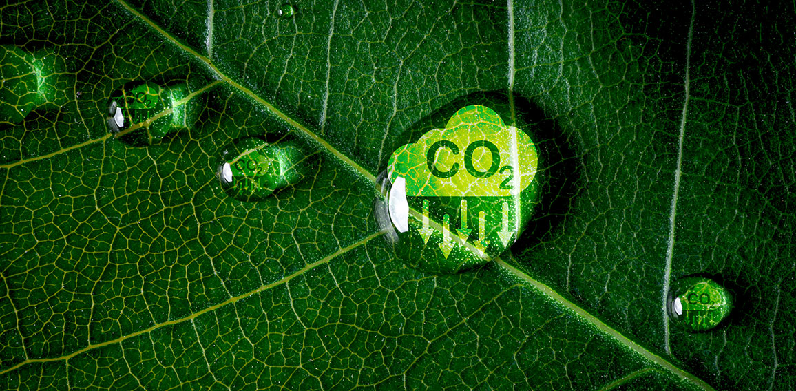 CO2 reducing icon on green leaf with water droplet for decrease