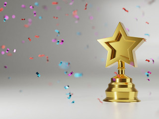 Golden star trophy cup on gold background. copy space for text.