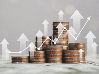 stack of silver coins with trading chart in financial concepts a