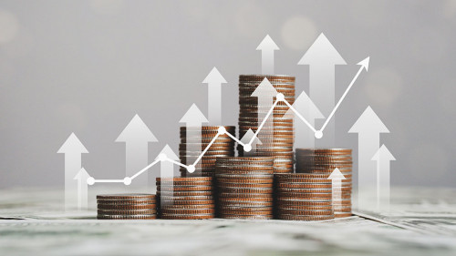 stack of silver coins with trading chart in financial concepts a