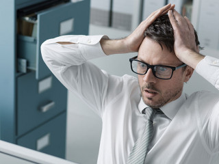 Panicking businessman receiving bad news