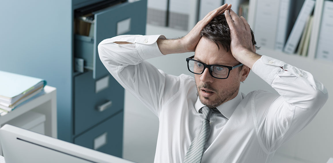 Panicking businessman receiving bad news