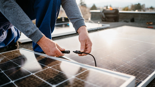 Worker installing solar energy panels. Alternative energy system. eco concept