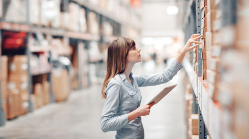 stock taking. beautiful young woman worker of furniture store.