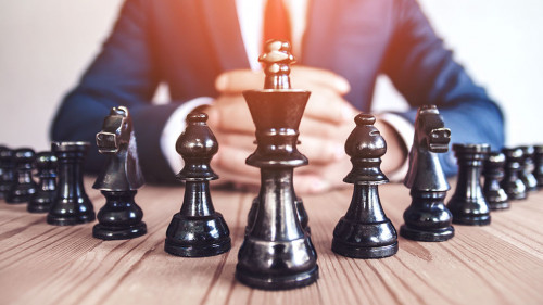 Retro style image of a businessman with clasped hands planning s