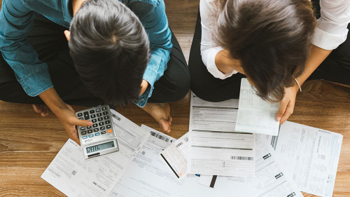 Top view asian couple sitting on the floor stressed and confused