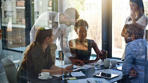 They give their all at work. Shot of a group of businesspeople having a meeting in a boardroom.