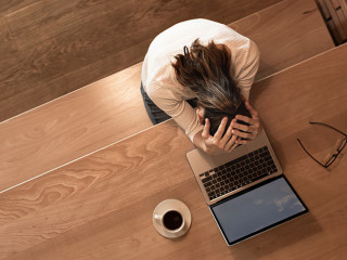 Tired emotional businesswoman at work. Late night stress problem