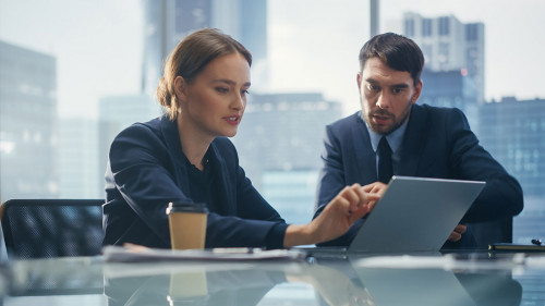 Successful Corporate CEO and Investment Manager Talking, Using L