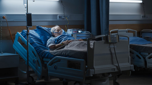 Hospital Ward: Portrait of Elderly Man Wearing Oxygen Mask Resti