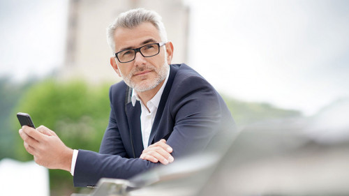 Businessman in town waiting for meeting