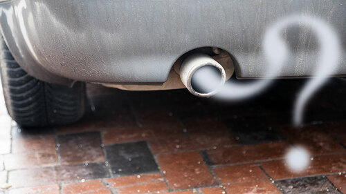 Exhaust from a car with diesel engine emitting gas in the shape