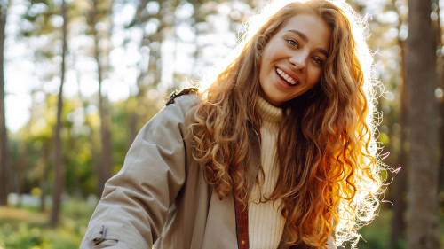 Beautiful woman riding bicycle in park. Lifestyle. Relax, natu