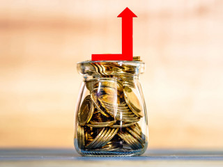 Bottle bank with gold coins inside and red arrow graph with grow