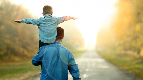 father and son walk in nature